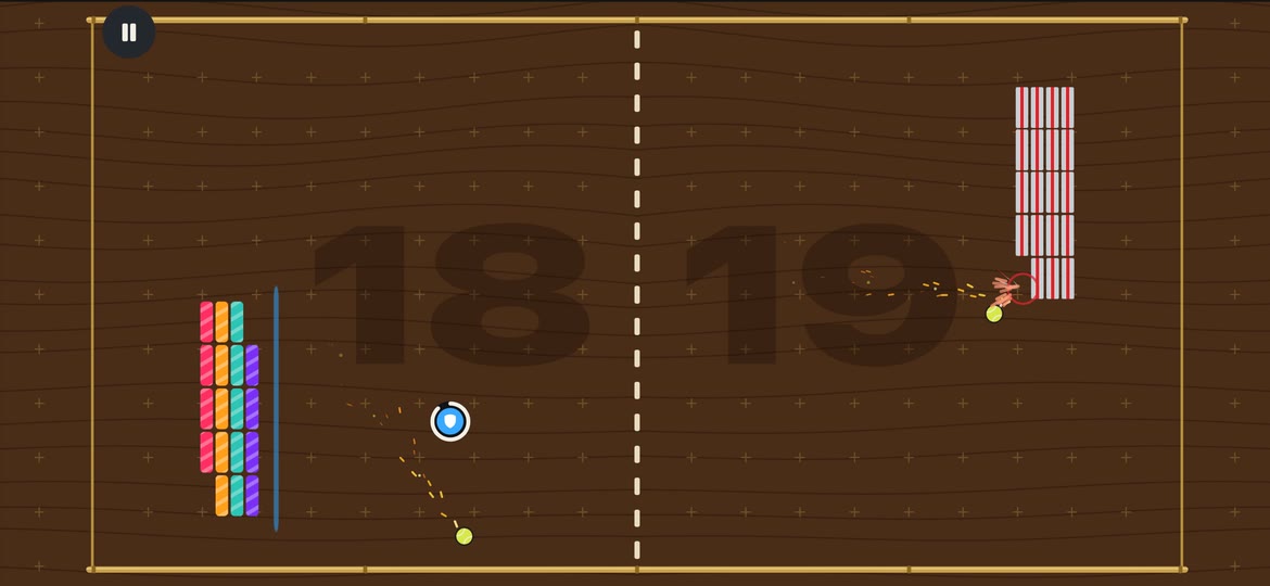 A match in Anti Pong on a walnut arena: two brick paddles, each missing a few bricks, with a ball heading for the left paddle and a shield power-up floating nearby
